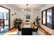 Modern dining room with wood table and black chairs at 1432 Jules Ct, Charlotte, NC 28226