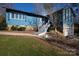 Ranch style home with blue siding, stone accents, and a white staircase at 1432 Jules Ct, Charlotte, NC 28226