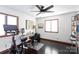 Home office with a Peloton bike, desk, and built-in shelving at 1432 Jules Ct, Charlotte, NC 28226