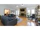 Living room with stone fireplace, hardwood floors, and lots of natural light at 1432 Jules Ct, Charlotte, NC 28226