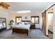 Spacious main bedroom with wood bed frame and barn door at 1432 Jules Ct, Charlotte, NC 28226