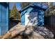 Blue storage shed with white doors in the backyard at 1432 Jules Ct, Charlotte, NC 28226