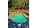 Inviting oval pool surrounded by stone and brick at 1432 Jules Ct, Charlotte, NC 28226