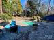 Relaxing kidney-shaped pool with brick patio and comfortable seating area at 1432 Jules Ct, Charlotte, NC 28226