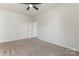 Bright bedroom with ceiling fan and neutral carpeting at 1527 Sunflower Field Pl, Matthews, NC 28104