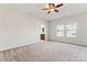 Comfortable bedroom with ceiling fan, carpeting and ensuite bathroom access at 1527 Sunflower Field Pl, Matthews, NC 28104