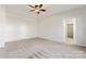 Large bedroom with ceiling fan, carpet, and walk-in closet at 1527 Sunflower Field Pl, Matthews, NC 28104