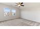 Spacious bedroom with two windows and ceiling fan at 1527 Sunflower Field Pl, Matthews, NC 28104