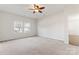 Spacious bedroom with ceiling fan and ample natural light at 1527 Sunflower Field Pl, Matthews, NC 28104