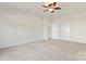 Bright and airy bedroom with ceiling fan and plush carpeting at 1527 Sunflower Field Pl, Matthews, NC 28104