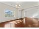 Bright dining room with hardwood floors and a chandelier at 1527 Sunflower Field Pl, Matthews, NC 28104