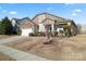 Two-story house with stone accents and a landscaped yard at 1527 Sunflower Field Pl, Matthews, NC 28104