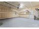 Spacious garage with overhead storage racks at 1527 Sunflower Field Pl, Matthews, NC 28104