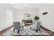 Bright home office featuring a modern desk, chairs, wood floors, and lots of natural light at 1527 Sunflower Field Pl, Matthews, NC 28104