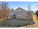 Tan house exterior with covered patio at 1527 Sunflower Field Pl, Matthews, NC 28104