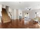 Spacious living area showcasing hardwood floors, fireplace and staircase at 1527 Sunflower Field Pl, Matthews, NC 28104