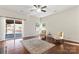 Bright living room with hardwood floors, fireplace, and sliding glass doors to backyard at 1527 Sunflower Field Pl, Matthews, NC 28104