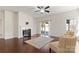 Living room featuring hardwood floors, fireplace and access to backyard at 1527 Sunflower Field Pl, Matthews, NC 28104