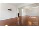 Hardwood floor living room with an open floor plan at 1527 Sunflower Field Pl, Matthews, NC 28104