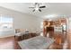 Spacious living room with hardwood floors and kitchen view at 1527 Sunflower Field Pl, Matthews, NC 28104