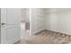 Large walk-in closet with wire shelving and bathroom access at 1527 Sunflower Field Pl, Matthews, NC 28104