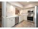 Modern kitchen with stainless steel appliances and white cabinets at 1575 Herlong Ct, Rock Hill, SC 29732