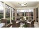 Relaxing screened porch with wicker furniture and ceiling fan at 1575 Herlong Ct, Rock Hill, SC 29732