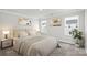 Bright and airy bedroom with neutral decor and ample natural light at 1608 Village Grove Ln, Monroe, NC 28110