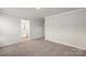 Bright bedroom with neutral walls and carpeting at 1608 Village Grove Ln, Monroe, NC 28110