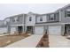 Modern two-story townhome with gray siding and two-car garage at 1608 Village Grove Ln, Monroe, NC 28110