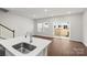 Kitchen island with sink and stainless steel faucet at 1608 Village Grove Ln, Monroe, NC 28110