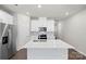 Modern kitchen featuring white cabinets and stainless steel appliances at 1608 Village Grove Ln, Monroe, NC 28110