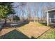 Fenced backyard with mature trees and a patio at 1652 Brook Dr, Fort Mill, SC 29708