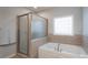 Bathroom with soaking tub, shower, and tile floors at 1652 Brook Dr, Fort Mill, SC 29708