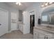 Bathroom with double vanity, walk-in closet, and tile flooring at 1652 Brook Dr, Fort Mill, SC 29708