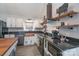 Farmhouse kitchen with copper sink and black countertops at 1652 Brook Dr, Fort Mill, SC 29708