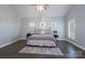 Spacious main bedroom with hardwood floors and a ceiling fan at 1652 Brook Dr, Fort Mill, SC 29708