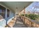 Long covered porch with wooden floors and railings at 1652 Brook Dr, Fort Mill, SC 29708