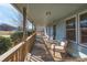 Covered porch with wooden swing and seating at 1652 Brook Dr, Fort Mill, SC 29708