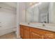 Clean bathroom with a double vanity and a tub at 16737 Winston Oaks Ct # 297, Charlotte, NC 28213