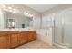 Double vanity bathroom with a soaking tub and shower at 16737 Winston Oaks Ct # 297, Charlotte, NC 28213