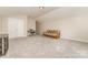 Spacious bonus room with carpet flooring, and plenty of natural light at 16737 Winston Oaks Ct # 297, Charlotte, NC 28213