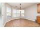 Bright breakfast nook with tile flooring and a view of the backyard at 16737 Winston Oaks Ct # 297, Charlotte, NC 28213