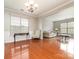 Formal dining room with hardwood floors and views into the living room at 16737 Winston Oaks Ct # 297, Charlotte, NC 28213