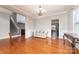 Bright dining room with hardwood floors and chandelier at 16737 Winston Oaks Ct # 297, Charlotte, NC 28213