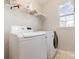 Laundry room with washer, dryer, and shelving at 16737 Winston Oaks Ct # 297, Charlotte, NC 28213