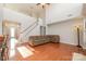 Spacious living room with hardwood floors, high ceilings, and a fireplace at 16737 Winston Oaks Ct # 297, Charlotte, NC 28213