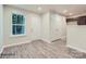 Front entry with wood-look floors, white door, and view of kitchen at 1750 J Julian Ln, Charlotte, NC 28208