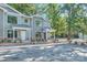 Newly built townhouses with landscaping, brick accents, and gray siding at 1750 J Julian Ln, Charlotte, NC 28208