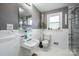 Clean bathroom with white tile, a shower, and a single sink vanity at 1750 Melrose Dr, Shelby, NC 28152